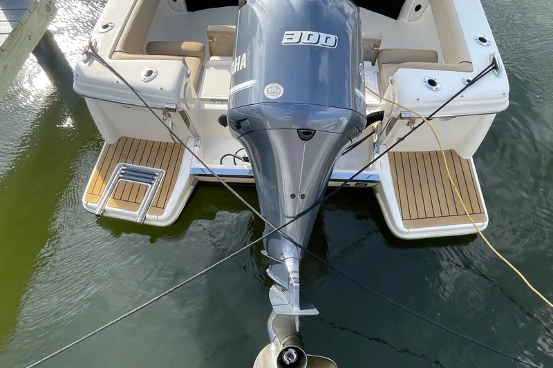 Slide: The Image of 2015 Scout 245 Dorado boat with Yamaha 300 engine, docked on water. - 43