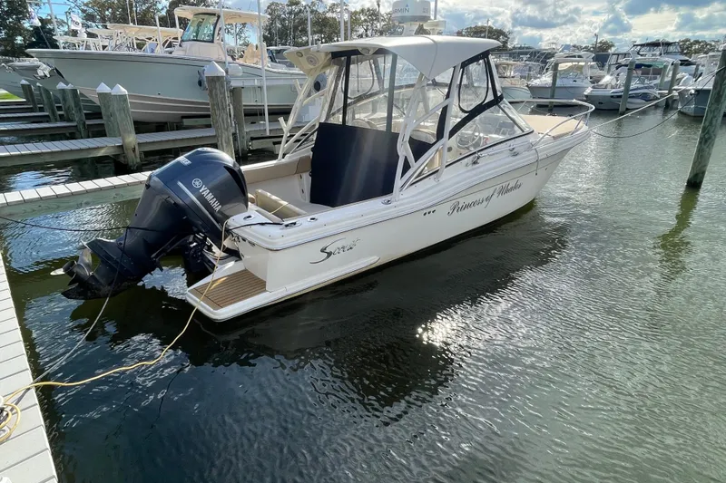 Slide: The Image of 2015 Scout 245 Dorado boat docked with Yamaha outboard motor. - 49