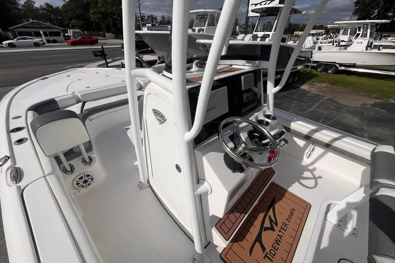 Slide: The Image of 2017 Tidewater 2500 Carolina Bay boat interior with steering wheel and console. - 12