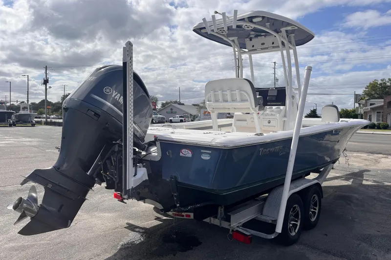 Slide: The Image of 2017 Tidewater 2500 Carolina Bay boat with Yamaha engine on trailer, parked outdoors. - 5