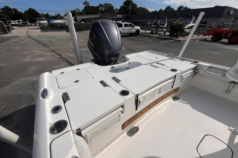 Slide: The Image of 2017 Tidewater 2500 Carolina Bay boat with Yamaha engine in a marina setting. - 6