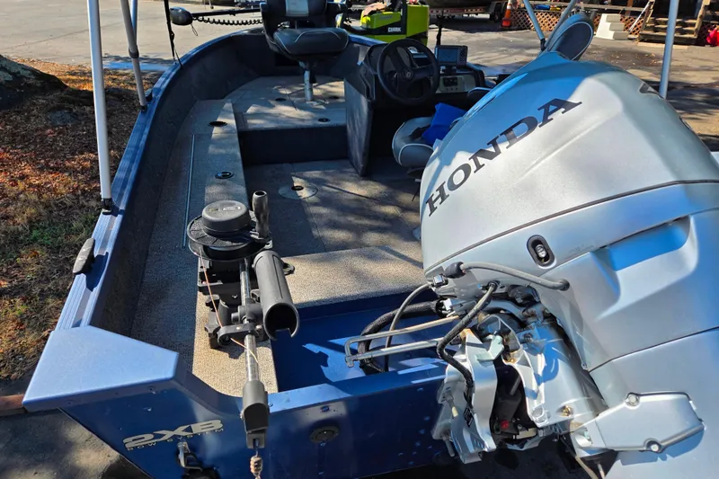 Slide: The Image of 2022 Alumacraft Escape 145 CS boat with Honda outboard motor, interior view. - 11