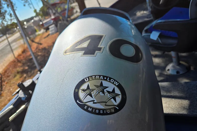 Slide: The Image of 2022 Alumacraft Escape 145 CS boat with ultra-low emission engine, featuring a 40 HP motor. - 5