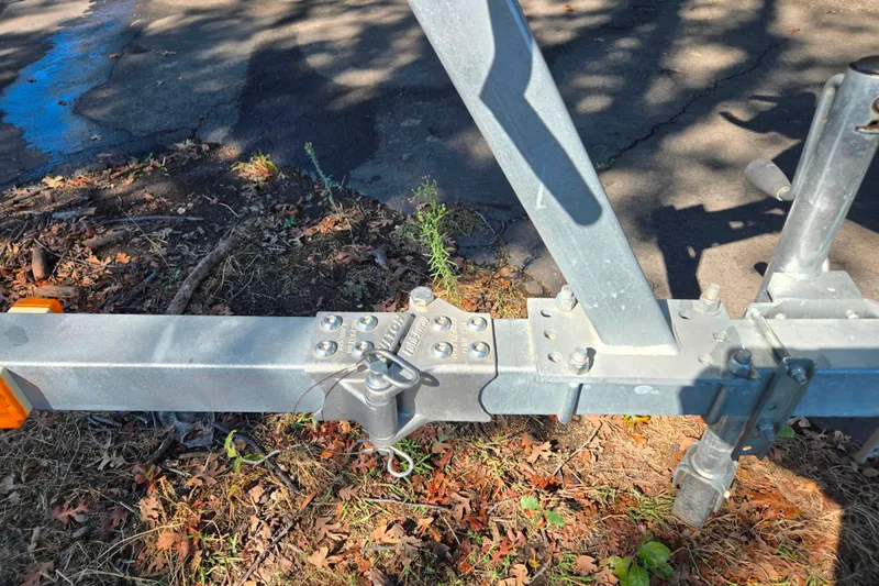 Slide: The Image of Trailer hitch of 2022 Alumacraft Escape 145 CS on a sunny day. - 8