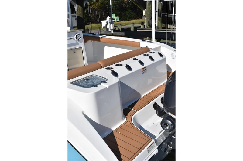 Slide: The Image of 2025 NauticStar 332 Offshore boat interior with seating and storage compartments. - 12