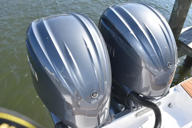 Slide: The Image of Twin Yamaha outboard engines on a 2025 NauticStar 332 Offshore boat. - 21