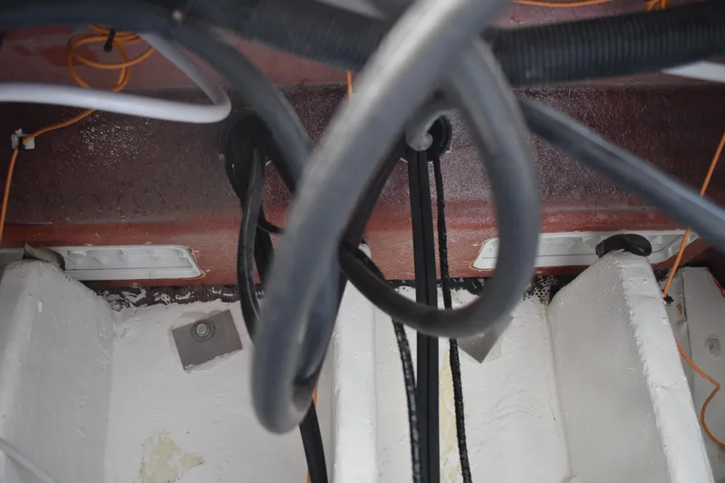 Slide: The Image of Interior view of 2025 NauticStar 332 Offshore boat wiring and components. - 32