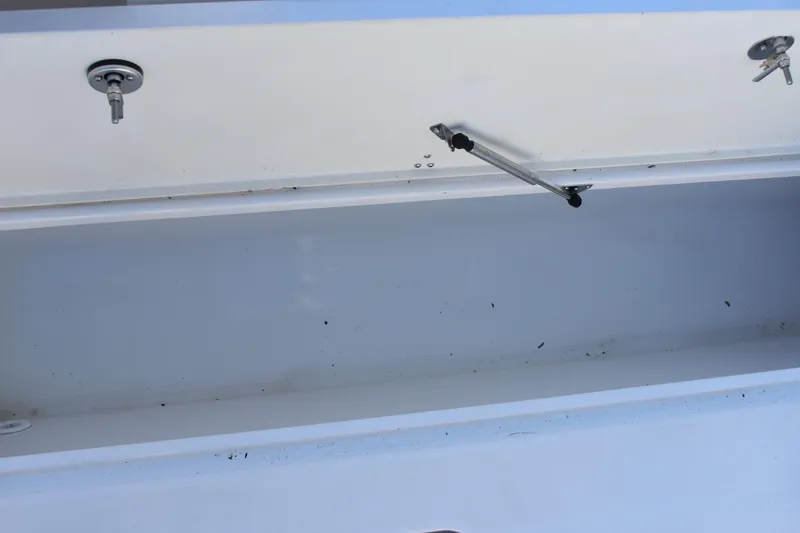 Slide: The Image of Open storage compartment on 2025 NauticStar 332 Offshore boat. - 34