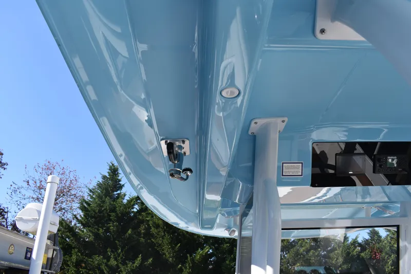 Slide: The Image of 2025 NauticStar 332 Offshore boat, blue exterior, detailed view of structure and equipment. - 46