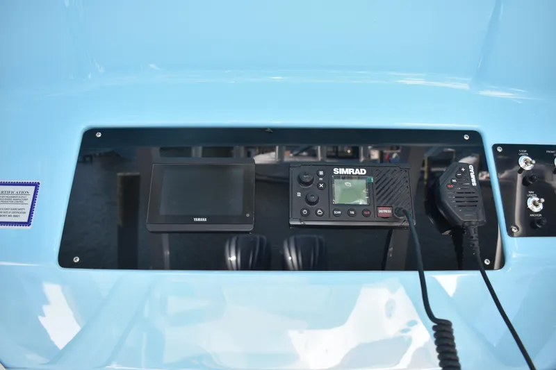 Slide: The Image of 2025 NauticStar 332 Offshore dashboard with Simrad and Yamaha electronics. - 55