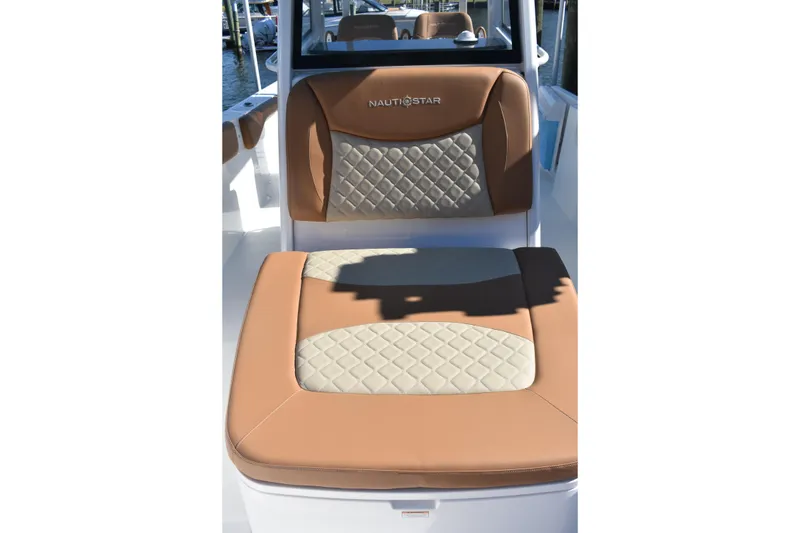 Slide: The Image of 2025 NauticStar 332 Offshore boat seat with tan and quilted design. - 74