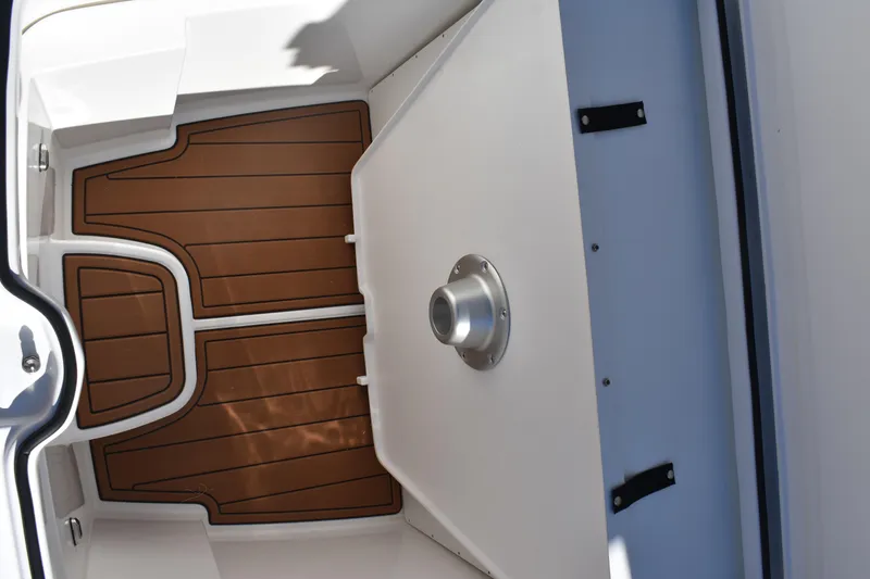 Slide: The Image of 2025 NauticStar 332 Offshore boat interior with wood-patterned flooring and sleek design. - 75