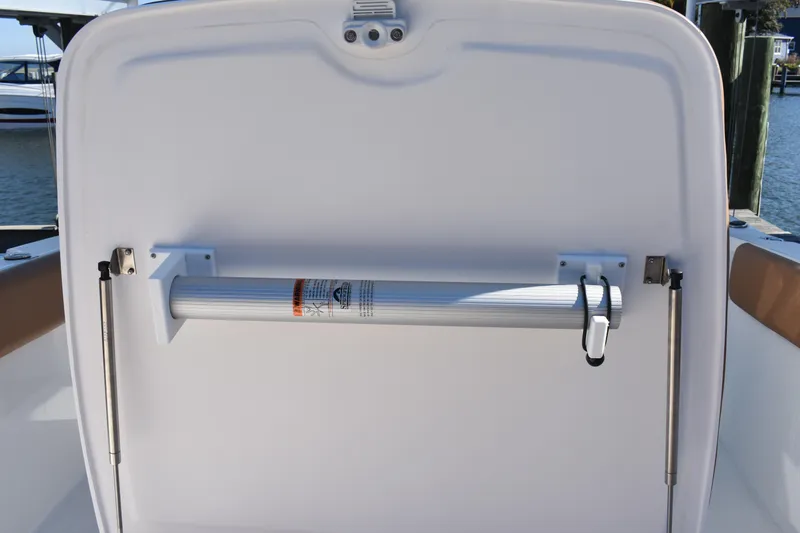 Slide: The Image of 2025 NauticStar 332 Offshore boat interior detail with mounted equipment. - 77