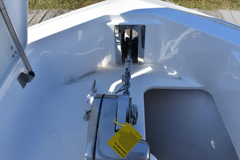Slide: The Image of 2025 NauticStar 332 Offshore boat anchor system in white deck area. - 79