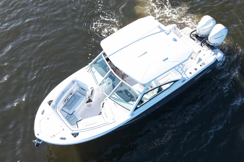 The Image of 2025 Blackfin 272 DC boat on water, featuring sleek design and dual outboard engines. - 0