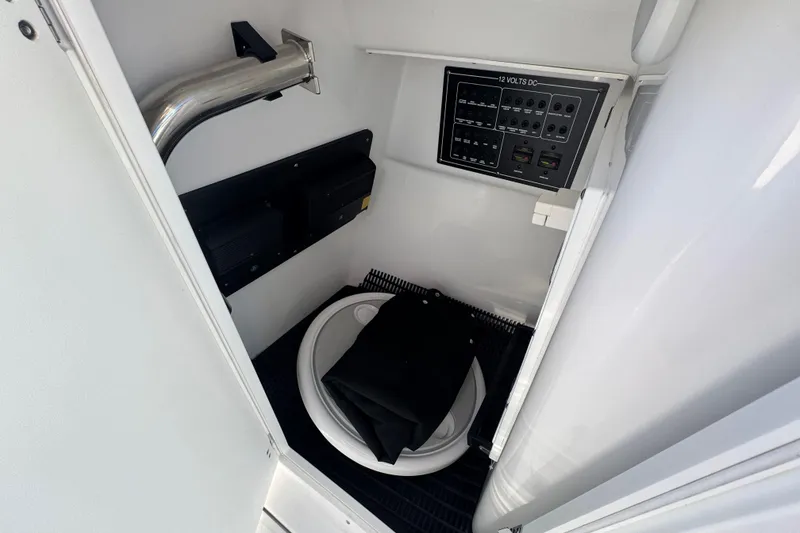 Slide: The Image of Blackfin 272 DC 2025 with Mercury engines on calm water. - 13