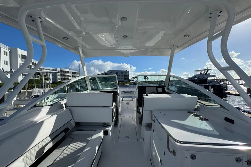 Slide: The Image of 2025 Blackfin 272 DC boat with open storage compartment on deck. - 20