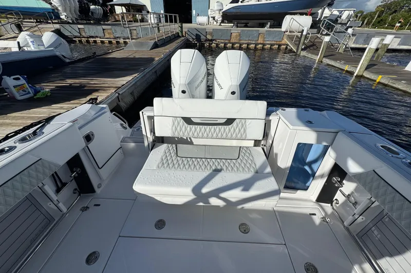 Slide: The Image of 2025 Blackfin 272 DC boat interior with seating, overlooking calm waters. - 21