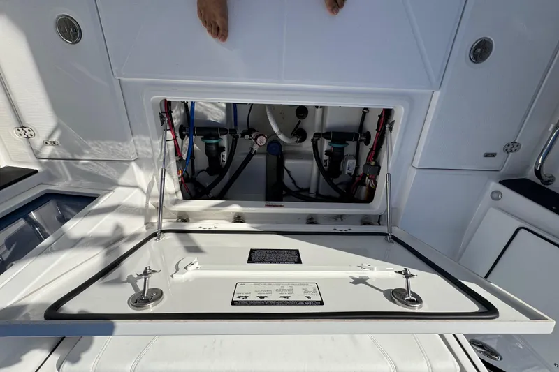 Slide: The Image of 2025 Blackfin 272 DC boat cruising on a sunny day, featuring spacious seating and modern design. - 26