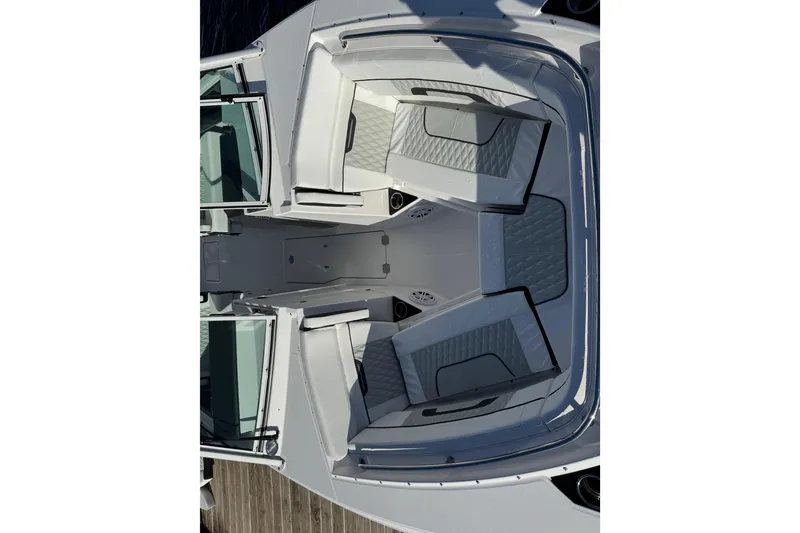 Slide: The Image of 2025 Blackfin 272 DC boat on water, rear view with dual engines. - 3