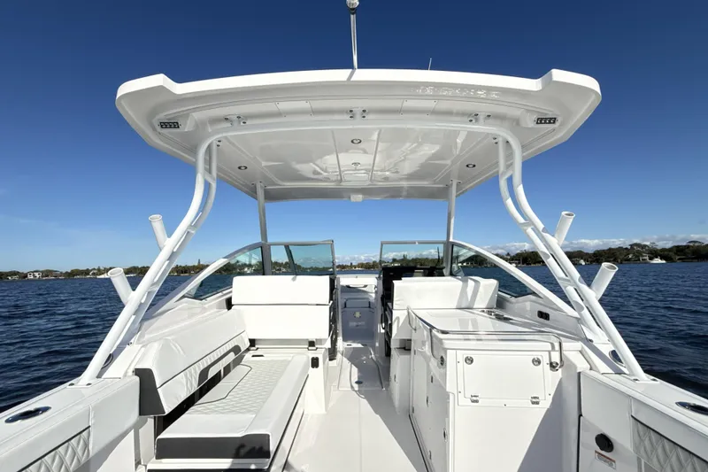 Slide: The Image of 2025 Blackfin 272 DC boat dashboard with steering wheel and navigation system. - 34