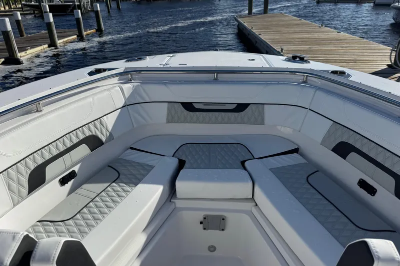 Slide: The Image of 2025 Blackfin 272 DC boat on water, featuring dual Mercury engines and sleek design. - 4