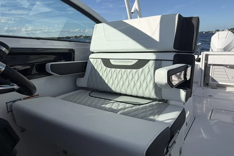 Slide: The Image of 2025 Blackfin 272 DC boat with sleek design on a sunny day. - 42