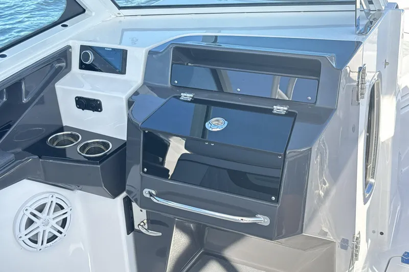 Slide: The Image of 2025 Blackfin 272 DC boat interior with luxurious seating on a sunny day. - 43