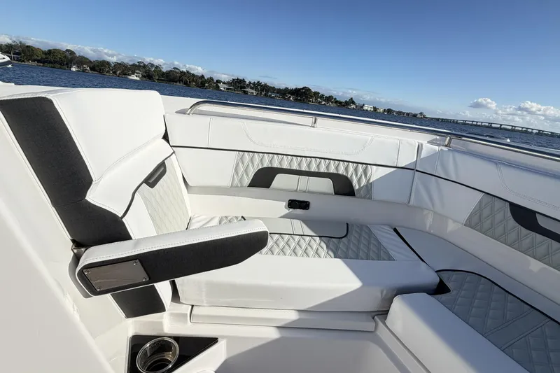 Slide: The Image of 2025 Blackfin 272 DC boat interior with luxurious seating on a sunny day. - 50