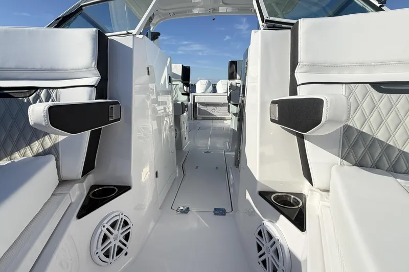 Slide: The Image of 2025 Blackfin 272 DC boat interior with compact bathroom, featuring a sink and toilet. - 57