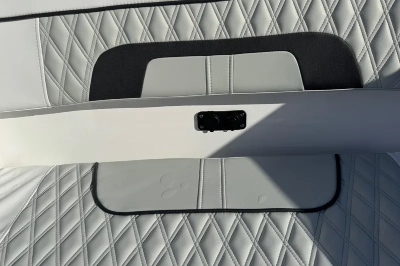 Slide: The Image of 2025 Blackfin 272 DC boat docked near waterfront buildings. - 6