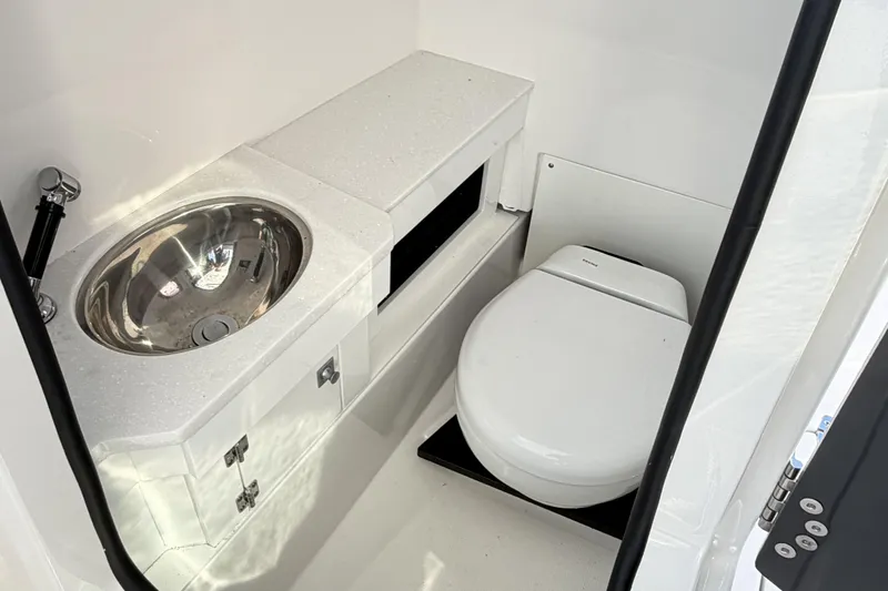 Slide: The Image of Electrical control panel on 2025 Blackfin 272 DC boat, featuring various switches and circuit breakers. - 63