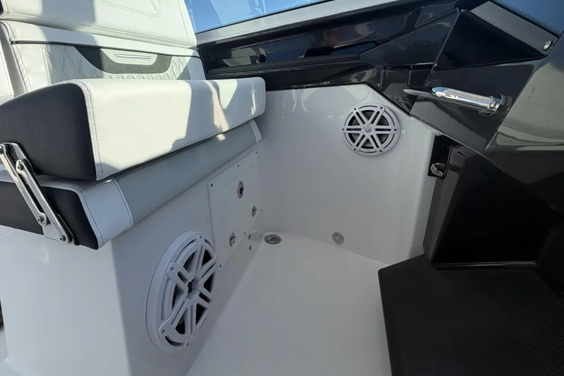 Slide: The Image of 2025 Blackfin 272 DC boat interior with white seating and modern design. - 70