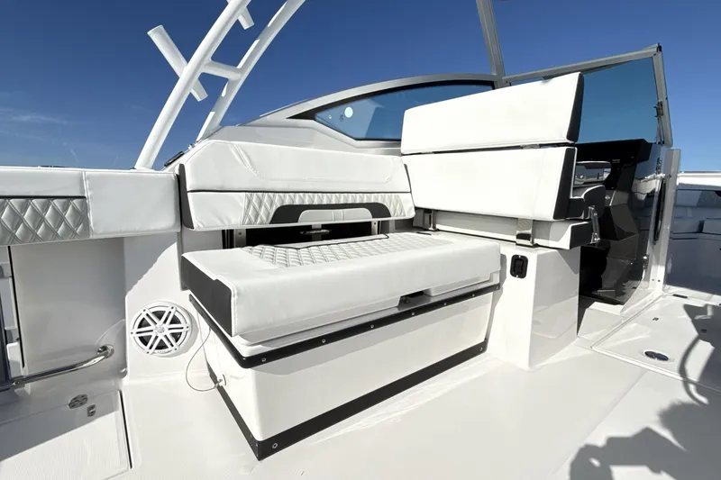 Slide: The Image of Luxurious seating on 2025 Blackfin 272 DC boat, featuring elegant white upholstery. - 72