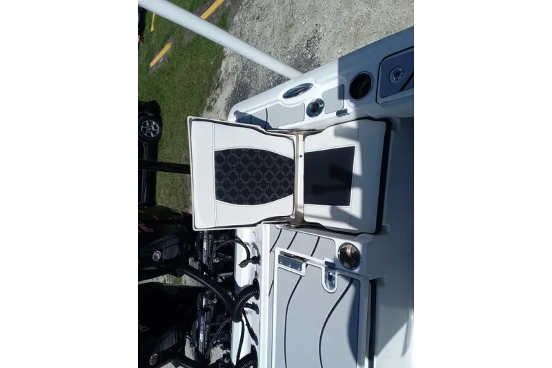 Slide: The Image of 2023 Tidewater 2700 Carolina Bay boat interior with seating and storage compartments. - 10