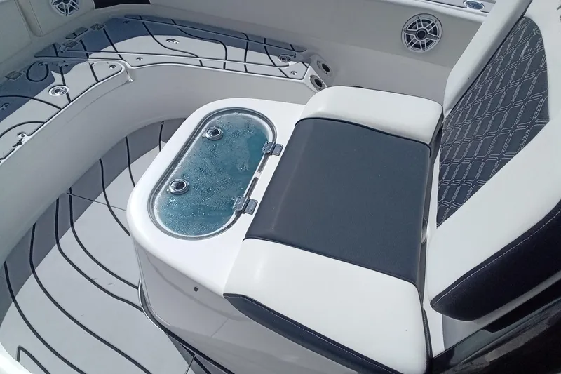 Slide: The Image of 2023 Tidewater 2700 Carolina Bay boat interior with seating and livewell. - 15