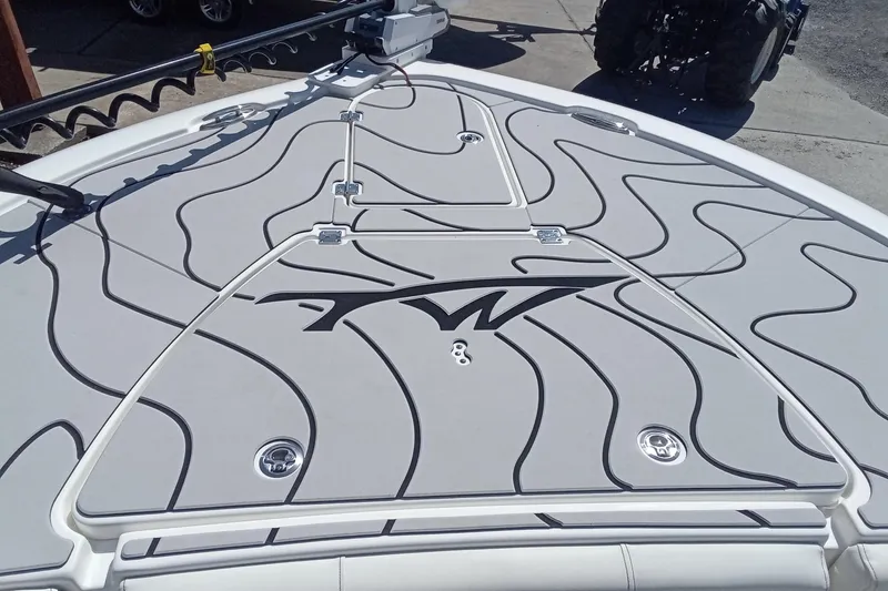 Slide: The Image of 2023 Tidewater 2700 Carolina Bay boat deck with stylish wave pattern design. - 16