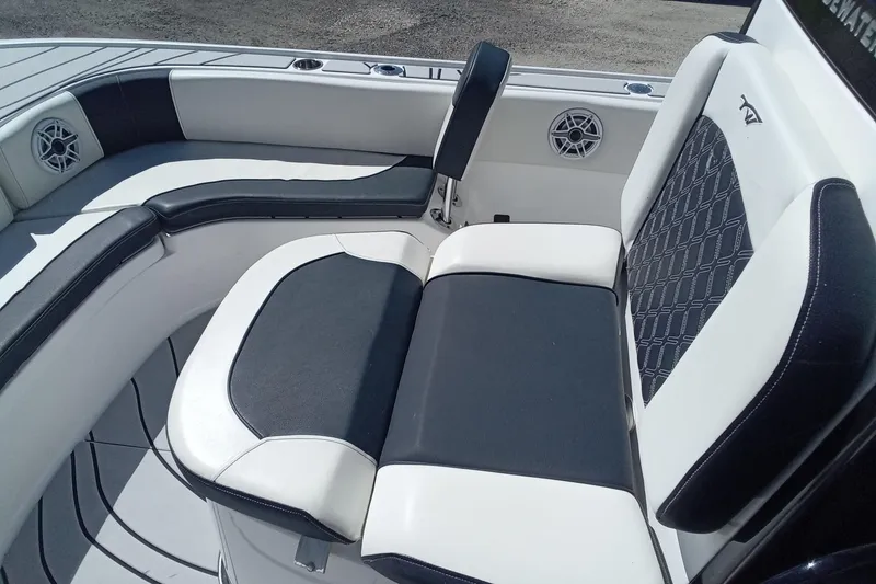 Slide: The Image of 2023 Tidewater 2700 Carolina Bay boat seating with black and white upholstery. - 21