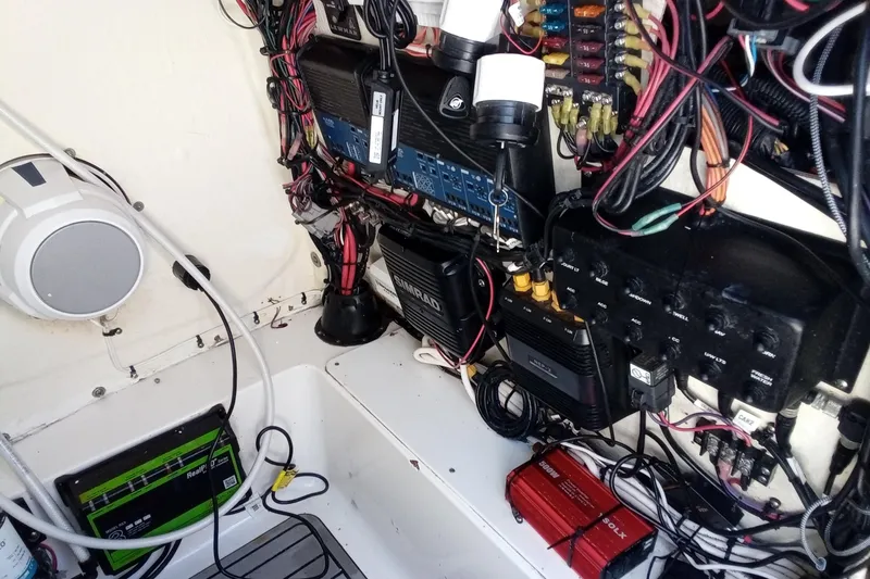 Slide: The Image of Electrical system of 2023 Tidewater 2700 Carolina Bay boat, featuring wiring and components. - 23