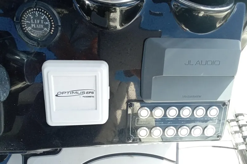 Slide: The Image of Control panel of 2023 Tidewater 2700 Carolina Bay boat with JL Audio and Optimus EPS systems. - 3