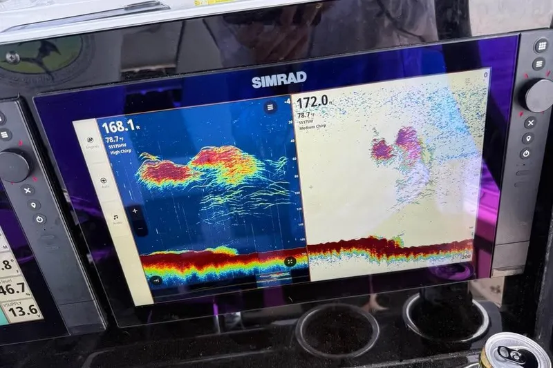 Slide: The Image of Simrad fishfinder display on 2023 Tidewater 2700 Carolina Bay boat, showing sonar readings. - 31