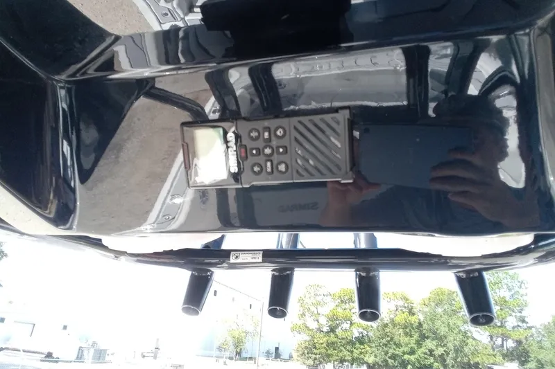 Slide: The Image of 2023 Tidewater 2700 Carolina Bay boat console with Simrad electronics and rod holders. - 8
