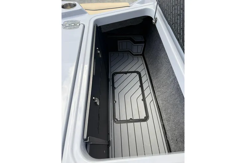 Slide: The Image of 2024 Nautique Super Air Nautique S23 storage compartment with sleek, modern design and durable flooring. - 15
