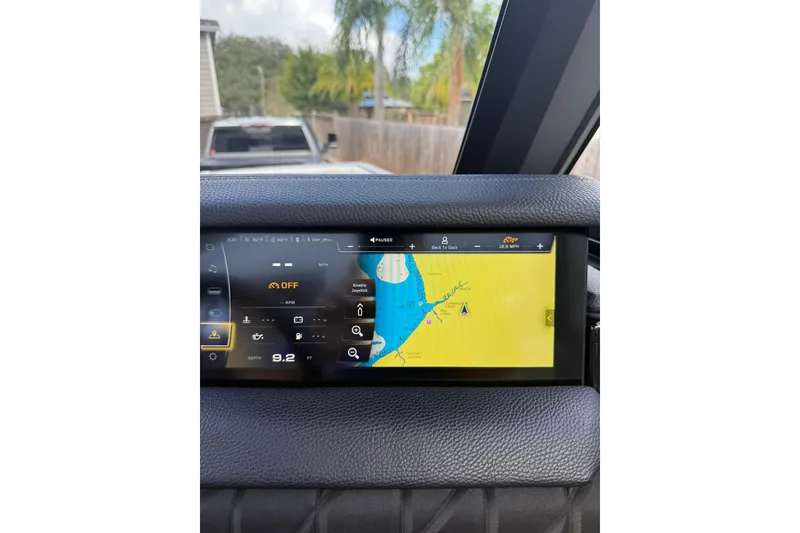 Slide: The Image of 2024 Nautique Super Air Nautique S23 dashboard with navigation display. - 3