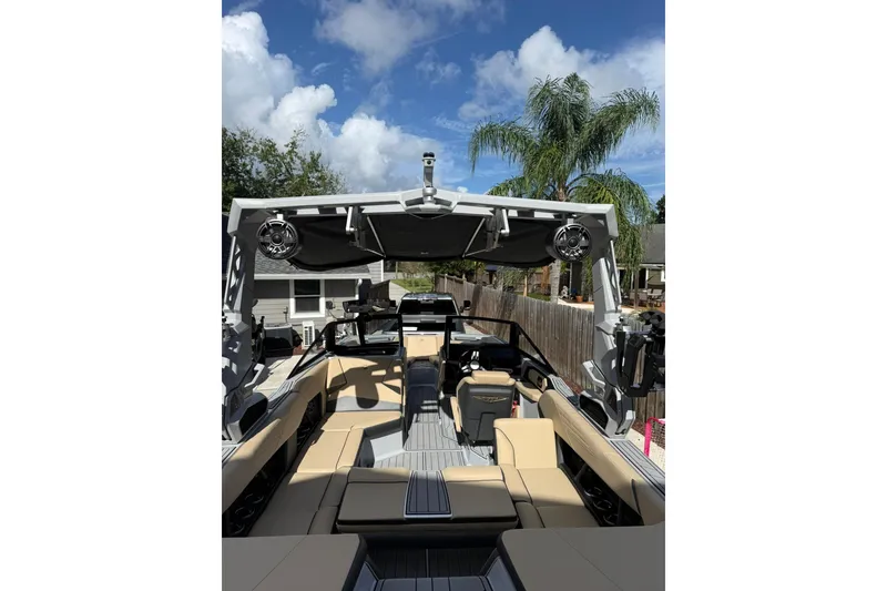 Slide: The Image of 2024 Nautique Super Air Nautique S23 boat interior with beige seating and modern design. - 4