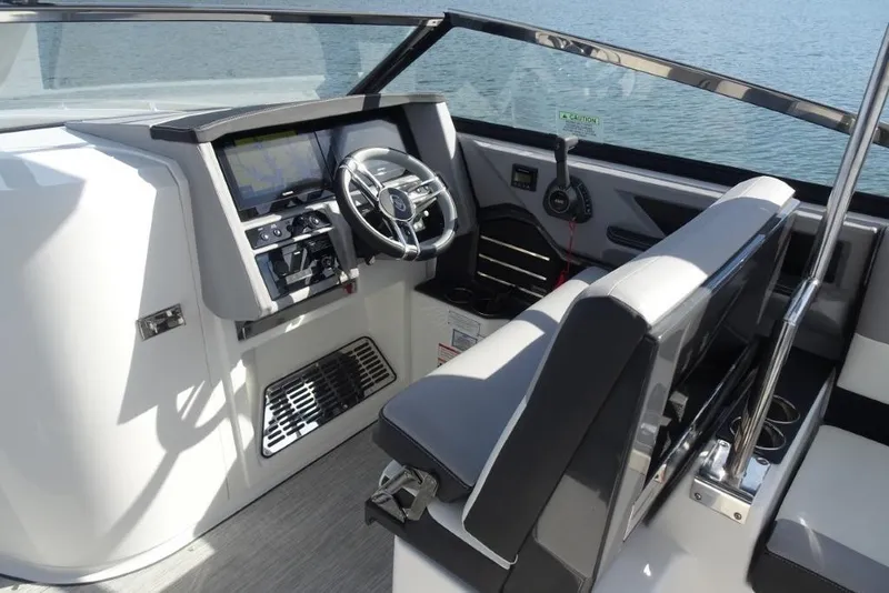 Slide: The Image of 2026 Cobalt A29 boat cockpit with modern steering and control panel. - 11