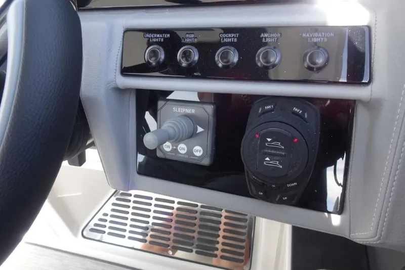 Slide: The Image of Control panel of 2026 Cobalt A29 boat with lighting and navigation switches. - 14