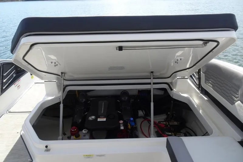 Slide: The Image of 2026 Cobalt A29 boat engine compartment open, revealing engine and components. - 25