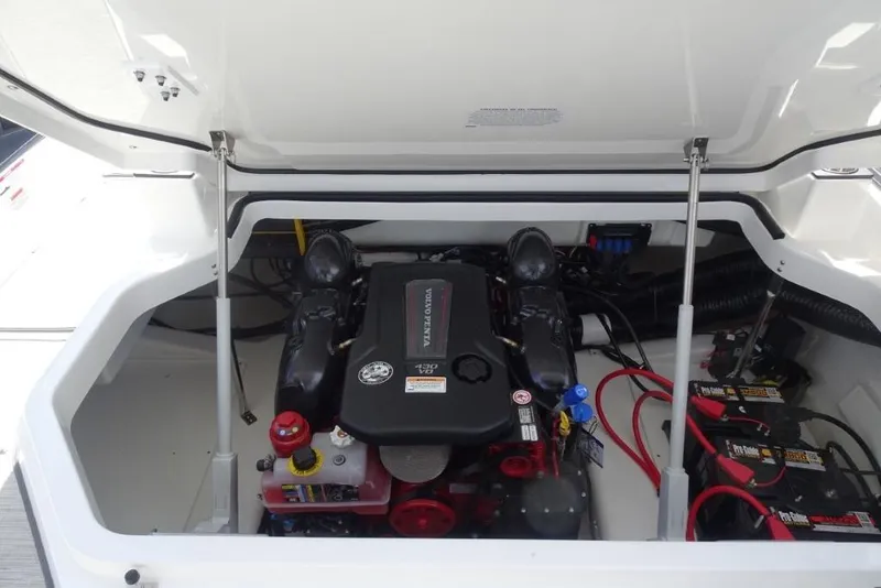 Slide: The Image of 2026 Cobalt A29 boat engine compartment with Volvo Penta engine and batteries. - 26