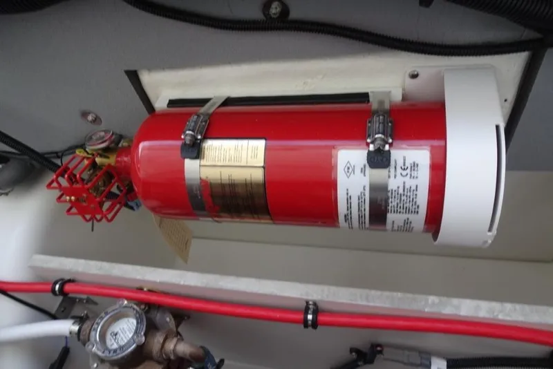 Slide: The Image of Fire extinguisher mounted in 2026 Cobalt A29 boat engine compartment. - 28